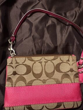 Coach Brown Signature Canvas Wristlet w Hot Pink Strp. Cor has small paint chip